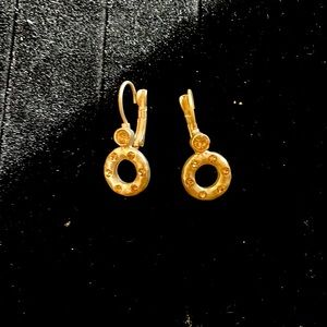 Never worn earrings. Gold color with sparkly embellishments